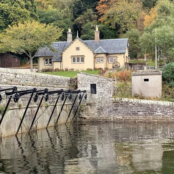 Exterior from sluice gates at Mound looking north to Sluice Keeper's Cottage, Dornoch