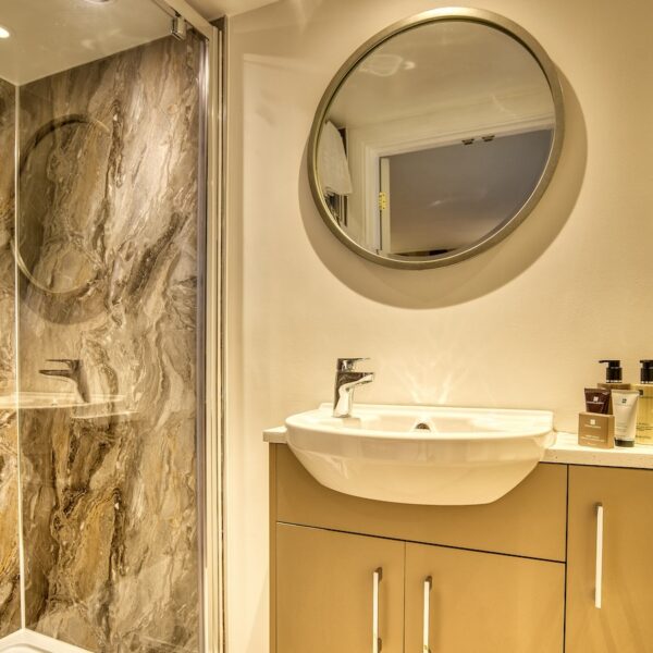 Ensuite shower room with grey marble tiling, The Meadows, Dornoch