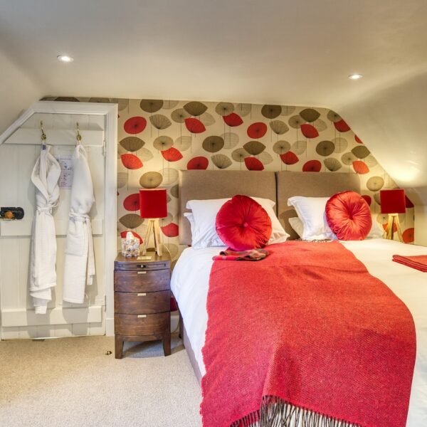 Double bedroom with red accent furnishings, The Meadows, Dornoch