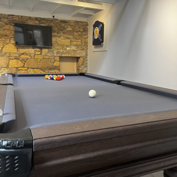 Games room in 2 Quail, Dornoch with pool table, tv and dart board