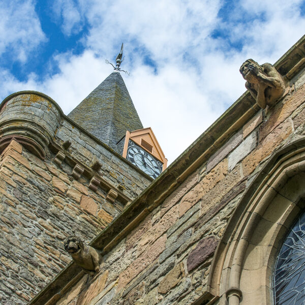 Exterior of Dornoch Cathedral with gargoyle