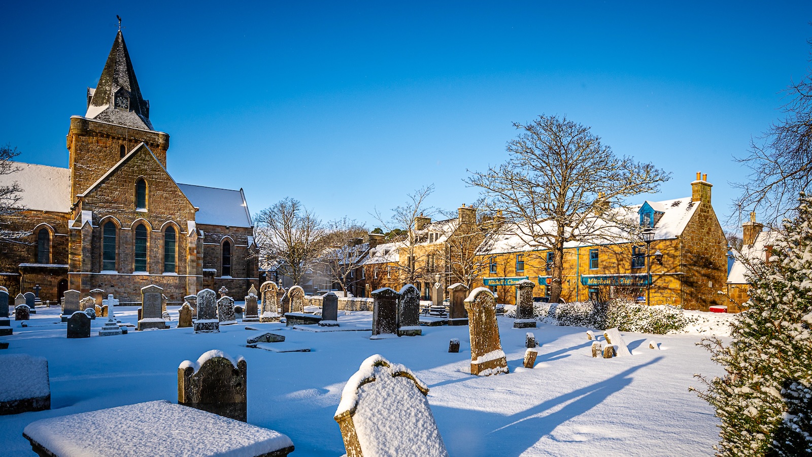 Snowy Cathedral graveyard and High Street Dornoch