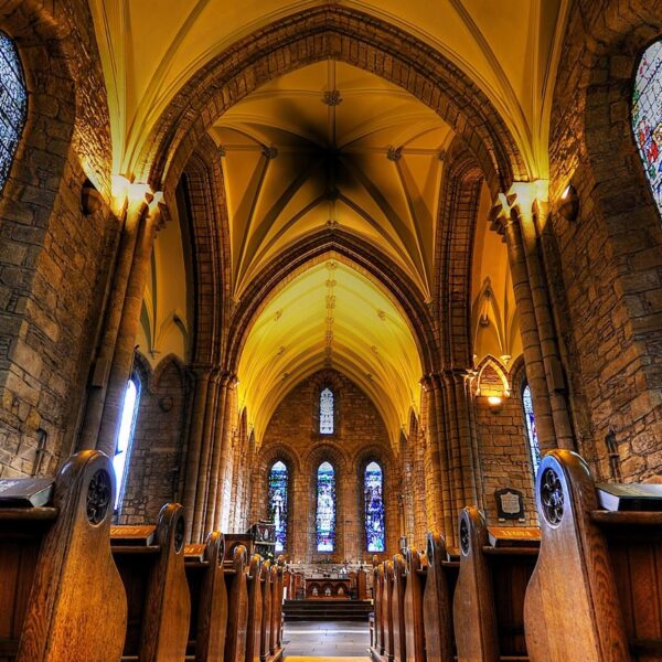 Interior of Dornoch Cathedral showing stained glass windows