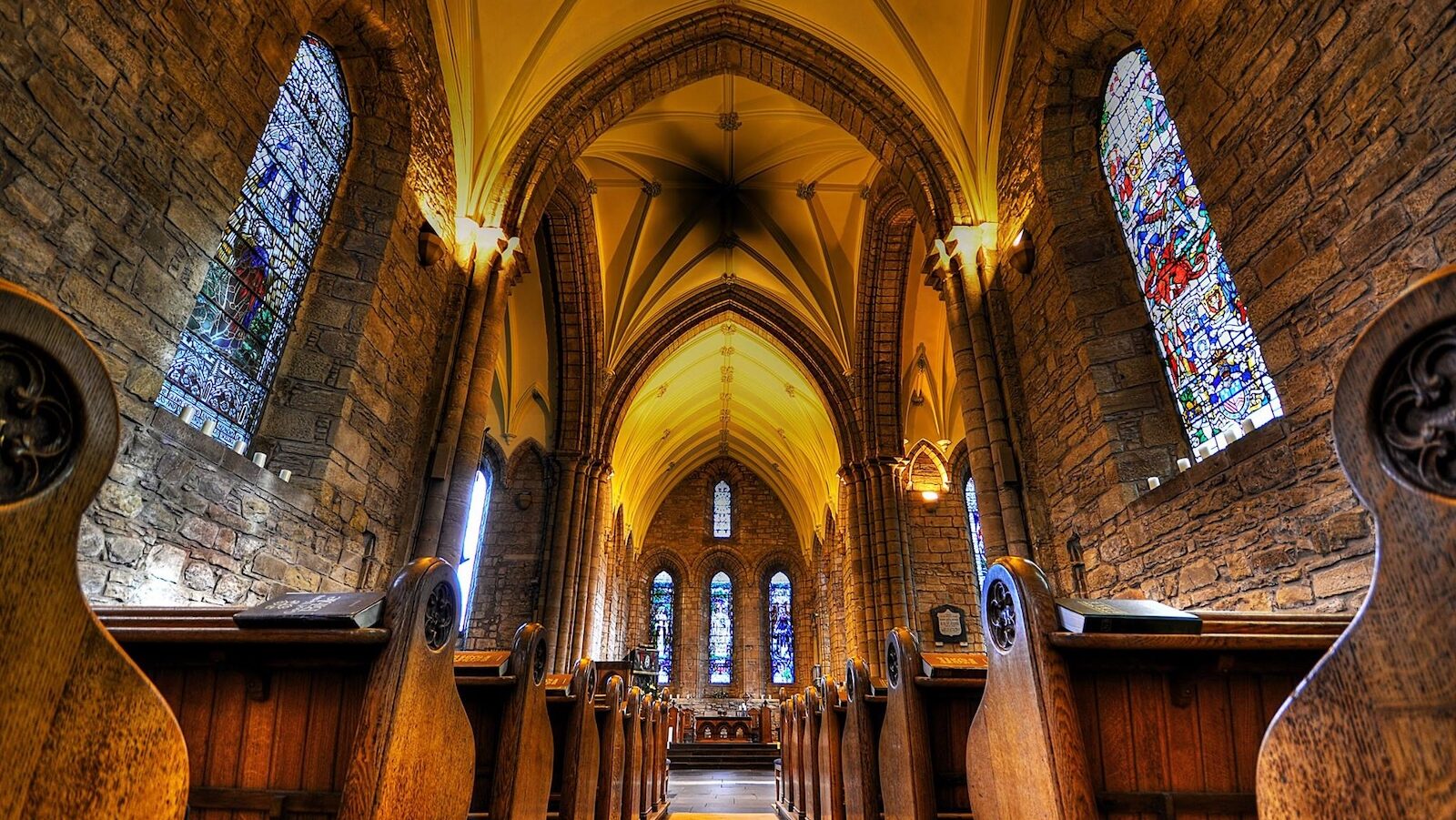 Interior of Dornoch Cathedral showing stained glass windows