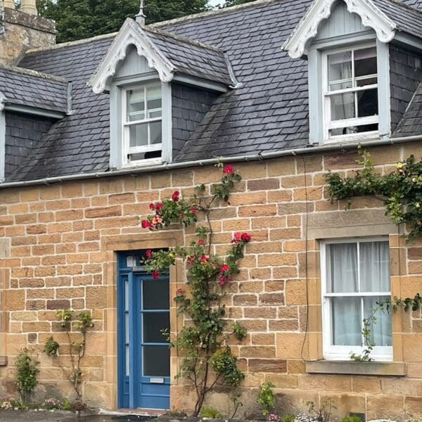 Front exterior of Gleann Gollaidh, Castle Street Dornoch with blue door