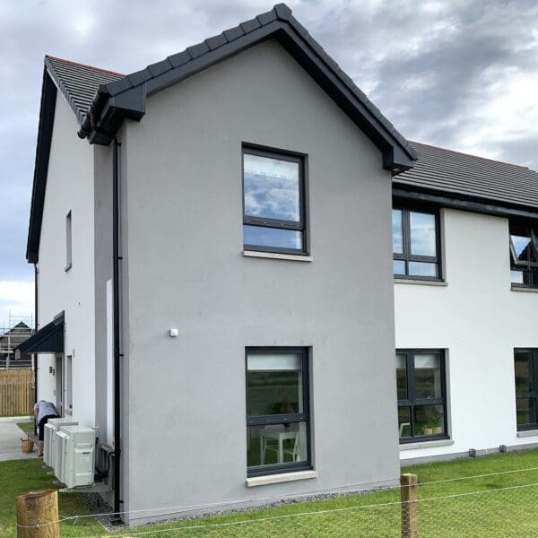 Exterior of 2 Sorley Avenue, Dornoch, duplex with grey and white walls