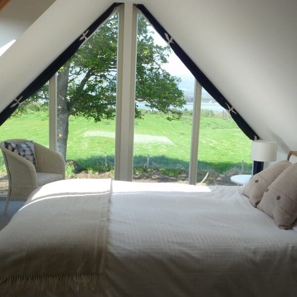 Cream bedroom suite with floor to ceiling window in Farthingworth holiday rental home, Skelbo, Dornoch