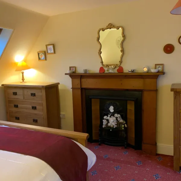 Fireplace in bedroom, East End Cottage, Dornoch