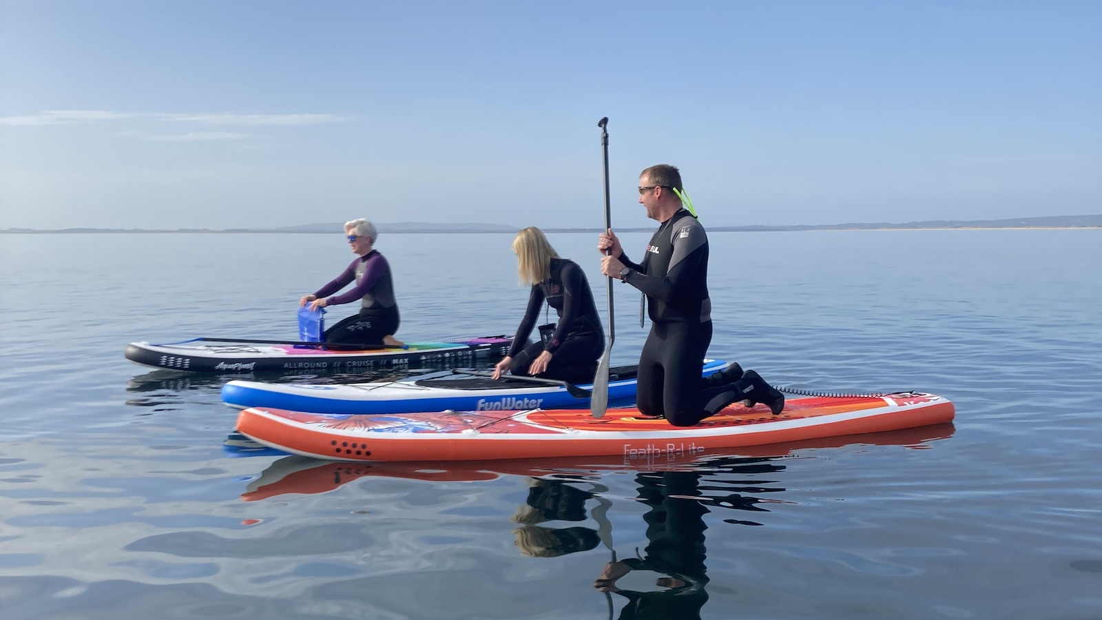 paddleboarding off Dornoch Beach