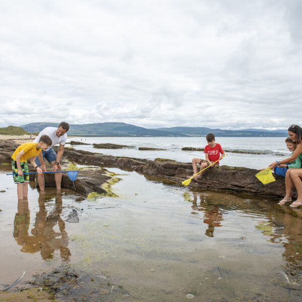 Family in rockpool with nets, Heilan Haim, Parkdean Resort, Embo