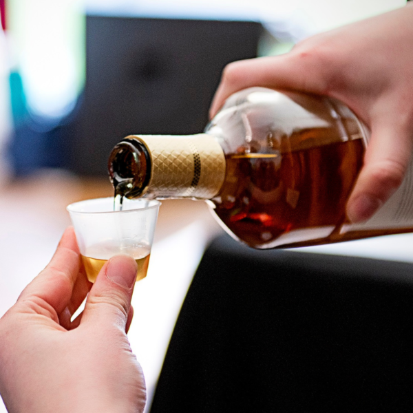 A bottle of whisky being poured